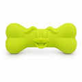 Green bone-shaped toy on a white background