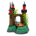 Packaged-style product image of a castle aquarium ornament with red and black towers, green rocky base, and attached plant details on a white background.