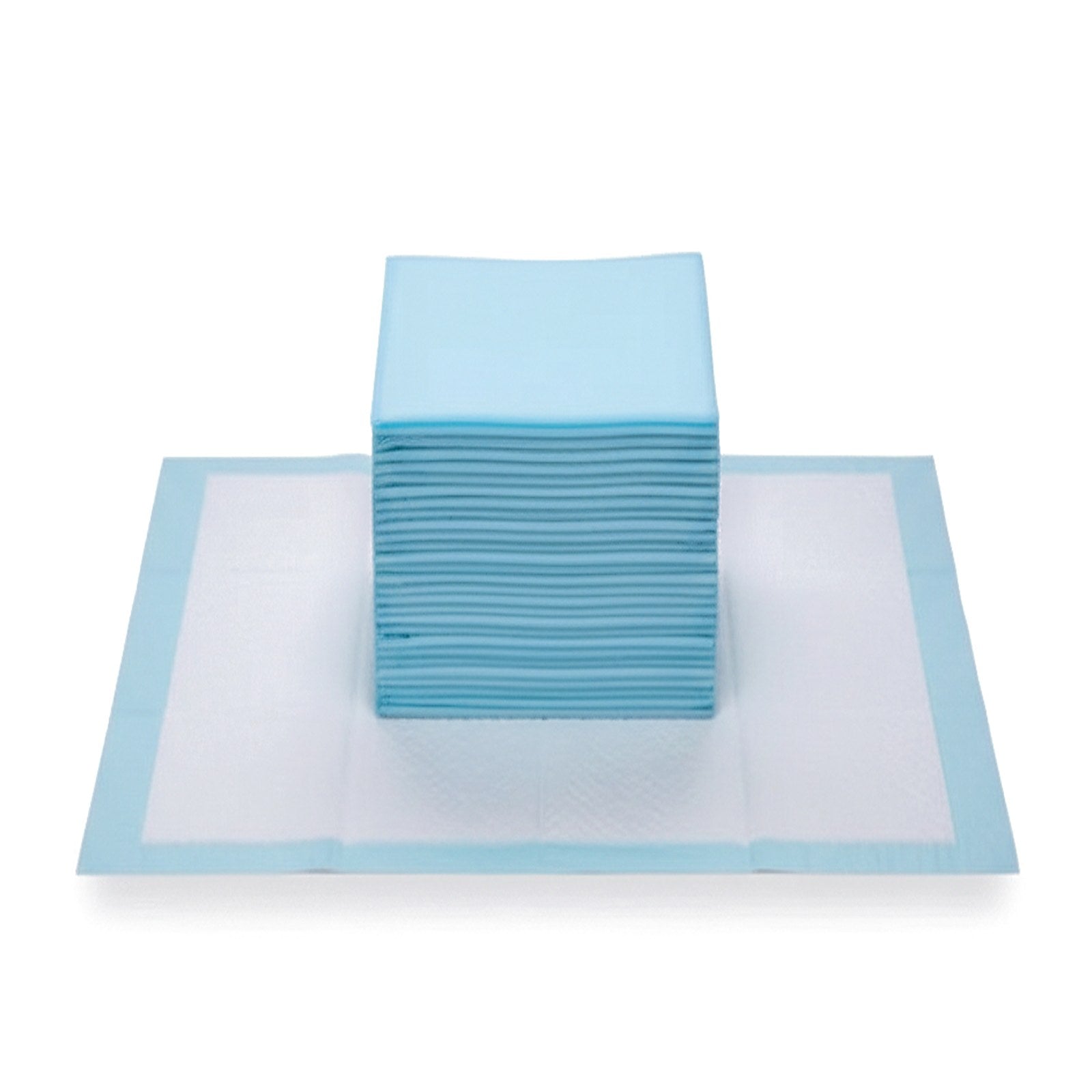 Stack of light blue training pads placed on an unfolded training pad